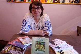 Allison Symes and some of her published works. Image by Adrian Symes
